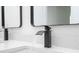 Close-up of sleek black faucet and countertop, highlighting the modern aesthetic at 6872 Sw 132Nd Pl, Ocala, FL 34473