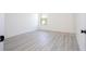Cozy bedroom features wood-look flooring, ample natural light, and neutral paint, creating a serene retreat at 6872 Sw 132Nd Pl, Ocala, FL 34473
