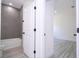A view of a bathroom and bedroom from a hallway in a newly constructed home at 6872 Sw 132Nd Pl, Ocala, FL 34473