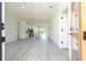 Open-concept living room boasts modern finishes and luxury vinyl plank flooring throughout the space at 6872 Sw 132Nd Pl, Ocala, FL 34473