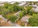 Aerial view of the home surrounded by mature trees at 730 Cordova Dr, Orlando, FL 32804