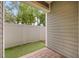 Cozy back patio featuring brick pavers, artificial turf, and a privacy fence at 730 Cordova Dr, Orlando, FL 32804