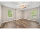 Bedroom featuring dual windows and hardwood floors at 730 Cordova Dr, Orlando, FL 32804