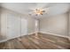 Bedroom featuring hardwood floors, ceiling fan, and closet at 730 Cordova Dr, Orlando, FL 32804