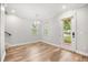 Bright dining room features wood floors, neutral paint, modern light fixture and natural light at 730 Cordova Dr, Orlando, FL 32804