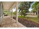 View of the front porch with brick flooring and view of the front yard at 730 Cordova Dr, Orlando, FL 32804