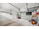Clean garage offering practical storage solutions with utility sink and garage door at 730 Cordova Dr, Orlando, FL 32804