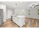 Bright, modern kitchen with white cabinetry, stainless steel appliances, and a central island at 730 Cordova Dr, Orlando, FL 32804