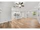 Open-concept living room connects seamlessly to the kitchen with stainless steel appliances and island at 730 Cordova Dr, Orlando, FL 32804