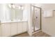 Elegant bathroom with double sinks, modern fixtures, and a glass-enclosed shower at 7968 Shaker St, Kissimmee, FL 34747