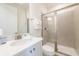 Bright bathroom with a walk-in shower and bright vanity at 7968 Shaker St, Kissimmee, FL 34747