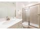 Bright bathroom featuring a sleek vanity with modern fixtures and a glass-enclosed shower at 7968 Shaker St, Kissimmee, FL 34747