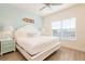 Charming bedroom with a large window, decorative headboard, and stylish nightstands at 7968 Shaker St, Kissimmee, FL 34747