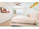 Inviting bedroom featuring a large bed, wall-mounted TV, and stylish accents at 7968 Shaker St, Kissimmee, FL 34747
