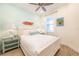 Cozy bedroom with nautical accents, white furniture, and plenty of natural light at 7968 Shaker St, Kissimmee, FL 34747