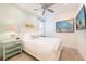 Comfortable bedroom with nautical accents, white furniture, and plenty of natural light at 7968 Shaker St, Kissimmee, FL 34747