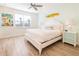 Cozy bedroom with beach-themed decor, comfortable bed, and ample natural light at 7968 Shaker St, Kissimmee, FL 34747