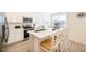Bright kitchen with white cabinets, stainless steel appliances, and breakfast bar seating at 7968 Shaker St, Kissimmee, FL 34747