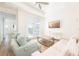 Bright living room with stylish furnishings, a large TV, and access to an outdoor space at 7968 Shaker St, Kissimmee, FL 34747