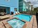 Relaxing backyard pool and spa with patio seating and a grill at 7968 Shaker St, Kissimmee, FL 34747