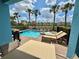Relaxing pool and spa with outdoor dining area and views of colorful community at 7968 Shaker St, Kissimmee, FL 34747