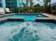 Inviting hot tub with built in blue tiles and fence at 7968 Shaker St, Kissimmee, FL 34747