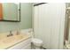 Clean bathroom featuring a sink, toilet, and a shower behind a white curtain at 854 Escabar Dr, Altamonte Springs, FL 32714