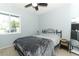 A simple bedroom, featuring neutral wall colors, a ceiling fan and standard furnishings at 854 Escabar Dr, Altamonte Springs, FL 32714