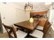 Bright dining area with a wooden table, modern chandelier, and a view of the kitchen at 854 Escabar Dr, Altamonte Springs, FL 32714