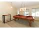 Open game room featuring a billiard table under a decorative chandelier at 854 Escabar Dr, Altamonte Springs, FL 32714