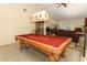 Large game room with billiard table, open to the living area with lots of natural light at 854 Escabar Dr, Altamonte Springs, FL 32714