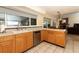 Kitchen with wood cabinets and stainless steel dishwasher at 854 Escabar Dr, Altamonte Springs, FL 32714