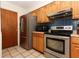 This kitchen is equipped with stainless steel appliances and wood cabinetry at 854 Escabar Dr, Altamonte Springs, FL 32714