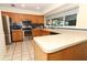 Kitchen with wood cabinets, stainless appliances, tile backsplash, and tile floors at 854 Escabar Dr, Altamonte Springs, FL 32714