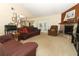 Cozy living room featuring a stone fireplace, comfortable seating, and large windows at 854 Escabar Dr, Altamonte Springs, FL 32714