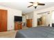 The main bedroom features carpet, a ceiling fan, and a TV at 854 Escabar Dr, Altamonte Springs, FL 32714