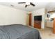 Main bedroom features carpet, a ceiling fan, TV, and access to the main bathroom at 854 Escabar Dr, Altamonte Springs, FL 32714