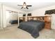 Spacious main bedroom with ceiling fan, carpet, and closet with mirrored doors at 854 Escabar Dr, Altamonte Springs, FL 32714