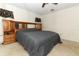 This main bedroom features a ceiling fan, carpet, and wood furnishings at 854 Escabar Dr, Altamonte Springs, FL 32714