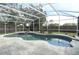 Inviting screened-in pool with a unique design and well-maintained deck, perfect for outdoor relaxation and entertaining at 854 Escabar Dr, Altamonte Springs, FL 32714
