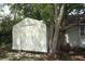 Backyard storage shed with good tree coverage and shade at 854 Escabar Dr, Altamonte Springs, FL 32714