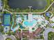 Aerial view of a community pool and lake at 8808 Macapa Dr, Kissimmee, FL 34747