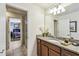 A well-lit bathroom features granite countertops, an undermount sink, and a walk-in shower at 8808 Macapa Dr, Kissimmee, FL 34747