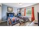 Comfortable bedroom featuring two twin beds, tasteful decor, and large windows for natural light at 8808 Macapa Dr, Kissimmee, FL 34747