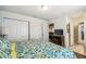 Bedroom with bed, dresser and access to bathroom and closet at 8808 Macapa Dr, Kissimmee, FL 34747
