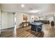 Spacious game room with a pool table, console table, and luxury vinyl plank flooring at 8808 Macapa Dr, Kissimmee, FL 34747
