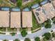 Aerial view displaying residences with screened-in pools and solar panels for energy efficiency at 8808 Macapa Dr, Kissimmee, FL 34747