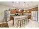 Spacious kitchen with stainless steel appliances, granite countertops, and center island with seating at 8808 Macapa Dr, Kissimmee, FL 34747