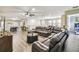 Expansive living area features a large sectional, a pool table, and recessed lighting at 8808 Macapa Dr, Kissimmee, FL 34747