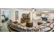 Spacious game room with billiards and entertainment area with leather seating at 8808 Macapa Dr, Kissimmee, FL 34747